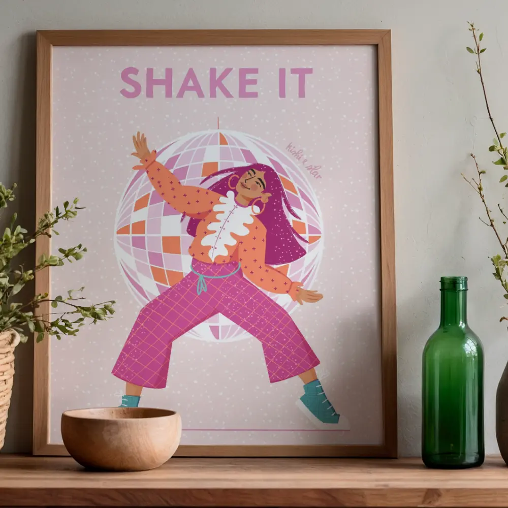 Framed print of a woman dancing in front of a pink disco ball