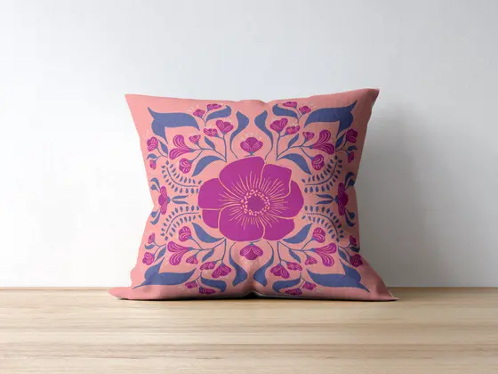 Cushion with a magenta flower medallion design